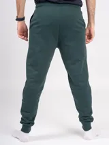 Pantalón babucha deportivo unisex azul, de tiro alto, con puños y cordones ajustables.