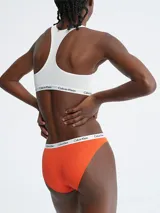 Bombacha clásica naranja de algodón con cintura elástica blanca con logo Calvin Klein.