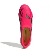 Championes de fútbol Adidas Predator League para terreno firme, con diseño de lengua plegable. Presentan una combinación de colores fucsia vibrante, blanco y detalles en negro, incluyendo las icónicas tres tiras laterales.