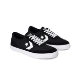Championes urbanos Converse modelo Net Star OX, color negro con detalles en blanco, confeccionados en lona y gamuza, con logo de estrella y galón en los laterales y suela de goma blanca.