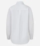 Camisa básica de mujer confeccionada en tricolina de algodón, con cuello solapa, cierre frontal de botones y mangas largas con puños abotonados.