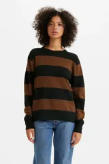 Sweater de punto a rayas horizontales color marrón y negro, de corte holgado y cuello redondo.