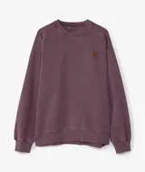 Buzo de cuello redondo Carhartt modelo Vista Sweat, color violeta con efecto lavado. Presenta un corte holgado, puños y ruedo acanalados, y un pequeño parche con el logo de la marca en el pecho.
