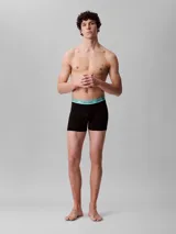 Pack de tres bóxer brief Calvin Klein de microfibra elástica color negro con cintura elástica celeste con logo de la marca.