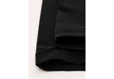 Calcetines negros de media caña con diseño abierto en el talón y la puntera.