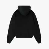 Campera tipo hoodie con cierre frontal, color negro, de corte oversize. Presenta un estampado gráfico en tono gris oscuro en el frente con el logo de la marca y la inscripción Nude Project Team, además de un pequeño bordado de una cereza en la manga.