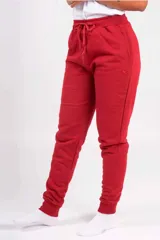 Pantalón de jogging unisex de felpa, color verde oscuro, con cintura elástica con cordón de ajuste y puños elásticos en los tobillos.