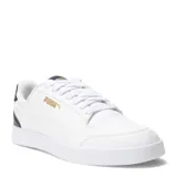 Championes urbanos Puma modelo Shuffle, de diseño clásico y silueta de bota baja. Presentan una parte superior de cuero sintético blanco con perforaciones en la puntera para mayor ventilación, cierre de cordones y plantilla SoftFoam+ para una amortiguación superior. Incluyen detalles de marca en dorado y refuerzo en el talón.