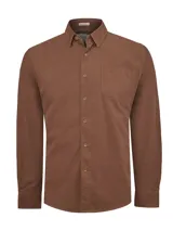 Camisa de manga larga confeccionada en tejido de cotele de algodón orgánico, color marrón castaño. Presenta cuello camisero con botones, cierre frontal con botones, puños abotonados y un bolsillo frontal en el pecho con detalle bordado.