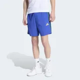 Short deportivo Adidas color azul con detalles en verde en los laterales y logo de la marca en amarillo. Cuenta con cintura elástica con cordón de ajuste.