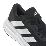 Championes de running Adidas Galaxy 7 W, color negro con las icónicas tres tiras laterales en blanco y suela con tecnología Cloudfoam para mayor amortiguación.