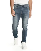 Jeans skinny para hombre, de corte ajustado y diseño de cinco bolsillos, con cierre de cremallera y botón metálico. Presenta un lavado azul medio con efecto desgastado.