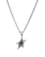 Collar con cadena de eslabones plateados y dije de estrella plateada con una piedra central de color azul.