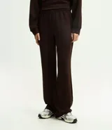 Pantalón de corte recto con cintura elástica y lazo de ajuste frontal. Confeccionado en tejido modal con caída fluida y estructura cómoda.