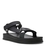 Sandalias Miss Carol modelo Jeli, color negro, con diseño estilo Teva, plataforma plana y tiras ajustables de goma.