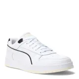 Championes urbanos Puma modelo RBD Game Low, color blanco con detalles en negro. Presentan un diseño inspirado en el básquetbol con perforaciones en la puntera, el logo de la marca en la lengüeta y la franja característica en los laterales. Cuentan con suela de goma con efecto envejecido.