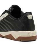Championes de fútbol sala Puma modelo Tifosi Calcio Ls, color negro con detalles en blanco y suela de goma color caramelo. Presentan un diseño acolchado con costuras visibles y el logo de la marca en la lengüeta.