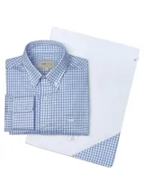 Camisa de manga larga RKF confeccionada en popelina de algodón, con diseño de cuadros en tonos azules y blancos. Presenta cuello con botones, cierre frontal abotonado, puños ajustables y bolsillo en el pecho con el logo de la marca bordado.