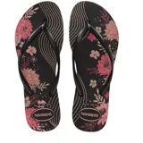 Sandalias tipo ojota Havaianas modelo Slim Organic, color negro con estampado floral en tonos rosados y dorados. Presentan tiras finas de goma negra con el logo de la marca en relieve.
