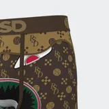 Calzoncillos bóxer PSD con estampado de un rostro de caricatura con dientes afilados y logo de la marca en la cintura.