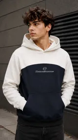 Canguro bicolor con capucha, diseño colorblock en blanco y azul marino, con bolsillo tipo canguro y estampado frontal de la marca Duxon Studios.