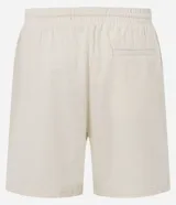 Bermuda masculina confeccionada en mezcla de algodón y lino con textura ligera, cintura elástica ajustable con cordón y bolsillos laterales.