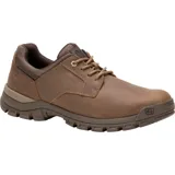 Zapato de estilo urbano Caterpillar, confeccionado en cuero color marrón, con cordones al tono, cuello acolchado y suela de goma dentada para mayor tracción.