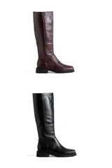 Botas de cuero de caña alta, con punta cuadrada y taco bajo. Disponibles en color bordó y negro.