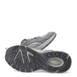 Championes Puma Milenio Tech Lt color gris con detalles plateados y suela amortiguada, diseñados para running y entrenamiento.