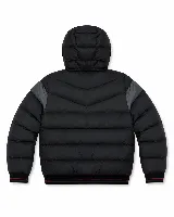 Campera puffer Mistral con capucha ajustable, diseño en bloques de color negro y gris, cierre frontal y parche con logo de la marca en el pecho.