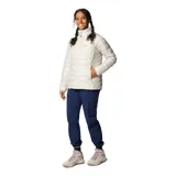 Campera acolchada Columbia modelo Powder Lite II, color beige, con cierre frontal completo, cuello alto con protección de barbilla y bolsillos laterales con cremallera. Cuenta con tecnología Omni-Heat™ termorreflectante y aislamiento sintético Thermarator™.