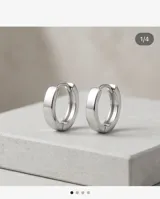 Aros abridores de plata 925 con diseño de argolla pequeña y cierre de presión.