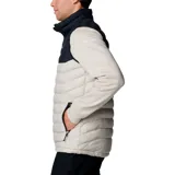 Chaleco Columbia Powder Lite II para hombre, con diseño bicolor en negro y beige. Presenta cierre frontal completo, cuello alto con protector de barbilla y bolsillos laterales con cierre. Cuenta con tecnología de aislamiento térmico y acabado resistente al agua.