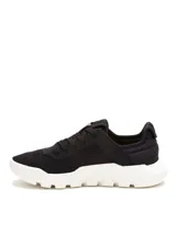 Sneaker Caterpillar modelo Hex Lite Vent, color negro con suela blanca de plataforma. Confeccionado en malla de nailon con detalles sintéticos, cierre mediante cordones y plantilla de espuma de PU.