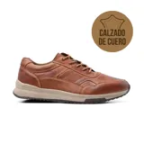 Zapato casual de cuero color marrón con cordones y suela de goma color beige.