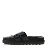 Sandalias tipo slider Bottero de cuero negro, con diseño de tiras anchas entrecruzadas y suela de plataforma plana con base dentada.