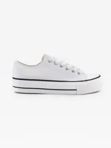 Zapatillas bajas de lona color blanco con suela de goma blanca con línea negra.