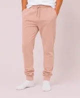 Pantalón tipo babucha de corte ajustado, con cintura elástica y cordón de ajuste, bolsillos laterales y puños elásticos en los tobillos.