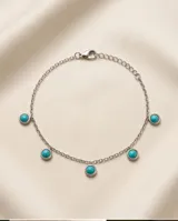 Tobillera de cadena de acero con dijes circulares colgantes con piedra turquesa.