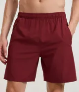 Bermuda deportiva Get Over para hombre, en color marrón, con cintura elástica, cordón de ajuste y bolsillos con cierre. Cuenta con tecnología Laser Cut en los laterales para mayor transpirabilidad.