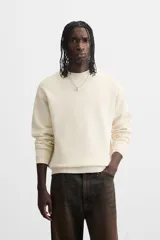 Jersey de punto de tacto suave con diseño de rayas horizontales anchas en color rosa claro y marrón oscuro. Presenta cuello redondo, manga larga y terminaciones en rib.