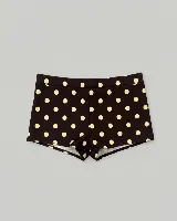 Short ajustado de licra con estampado de lunares negros sobre fondo blanco. Diseño de tiro medio y corte corto.