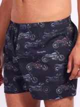 Bóxer de algodón blanco con estampado de flores pequeñas color celeste, con cintura elástica y logo de la marca en el centro.