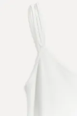 Top lencero blanco de viscosa con escote redondo y tirantes finos.