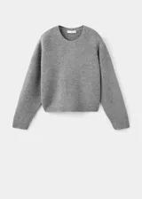 Jersey de punto de cuello redondo, corte recto y manga larga, con acabado de canalé en puños y bajo.