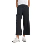 Pantalón negro de corte ancho, con cintura elástica y bolsillos laterales.