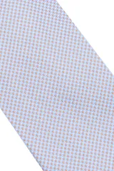 Corbata morada con pequeños lunares blancos.