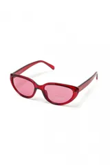 Lentes de sol Nuit con marco rojo transparente y lentes rosados, de forma ovalada y estilo retro.