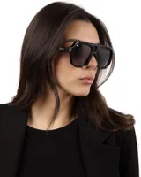 Lentes de sol negros estilo aviador con montura gruesa de acetato. Lentes polarizados con protección UV400.