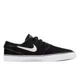 Championes Nike SB Zoom Janoski de perfil bajo, color negro con el logo de Nike en blanco en el lateral y suela de goma blanca vulcanizada.